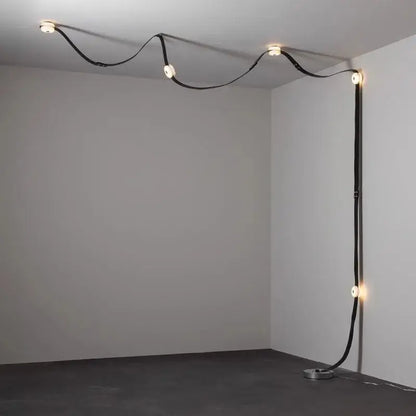 Decorbites black leather marble chandeliers feature a curved minimalist black leather cord with integrated circular lights