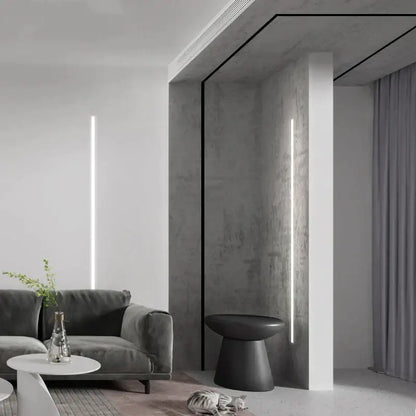 Gray velvet sofa with sleek modern design and minimalist armrests paired with decorbites black led aluminum profile for invisible ceiling light strip bar