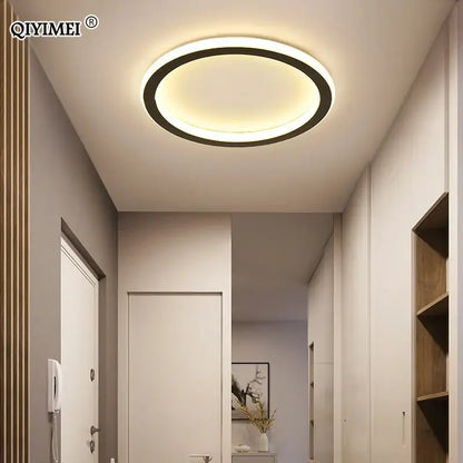 Modern circular decorbites black led ceiling light with sleek black ring and warm white glow for indoor entryway use