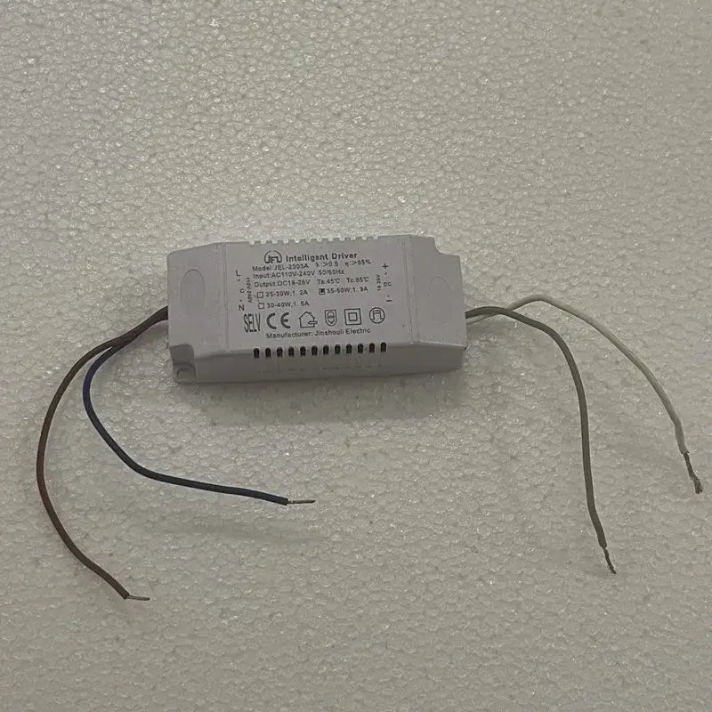 Gray rectangular led driver with labeled specifications and three exposed wires for decorbites black led chandelier