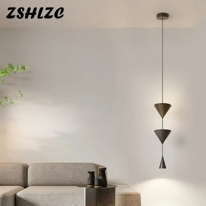 Modern black metal led pendant chandelier with stacked conical shades for nordic home decor by DecorBites