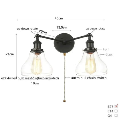 Black iron DecorBites black LED wall sconce with two adjustable arms and clear glass bell-shaped shades for bathroom mirror