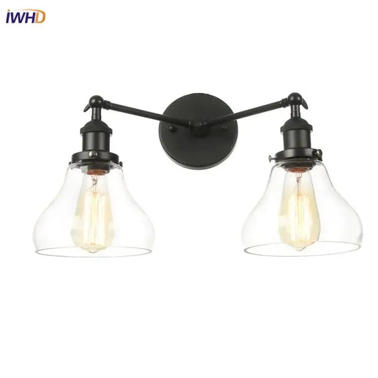 DecorBites black led wall sconce with two black wrought iron arms and clear glass bell-shaped shades for bedroom bathroom mirror