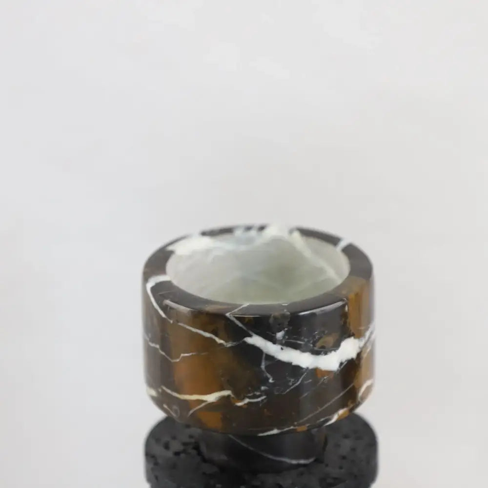 Decorbites black marble candle holder with polished cylindrical design featuring brown black marble and white veining