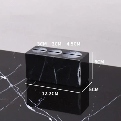 DecorBites black marquina bathroom set featuring a black marble three-compartment vase with polished surface and white veining