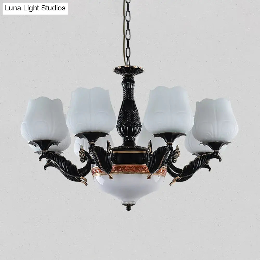DecorBites black metal chandelier with ornate metalwork and frosted glass shades in white floral design