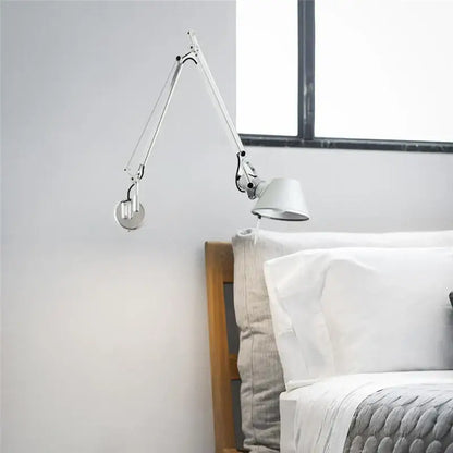 A sleek decorbites black silver rotatable wall light with articulated metallic joints for study or office use
