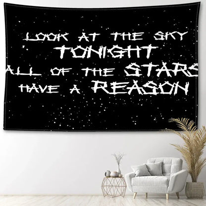 Black wall tapestry with white stardust background and bold distressed lettering for decorbites black sky art bedroom decor