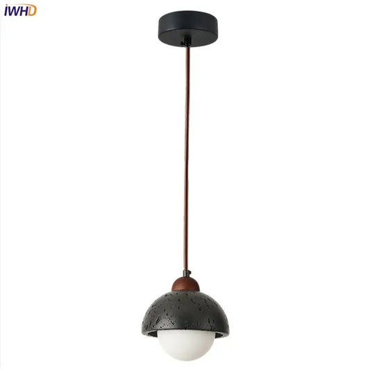 Decorbites black travertine led pendant lamp with black textured dome, white glass bulb, and copper accents for dining room