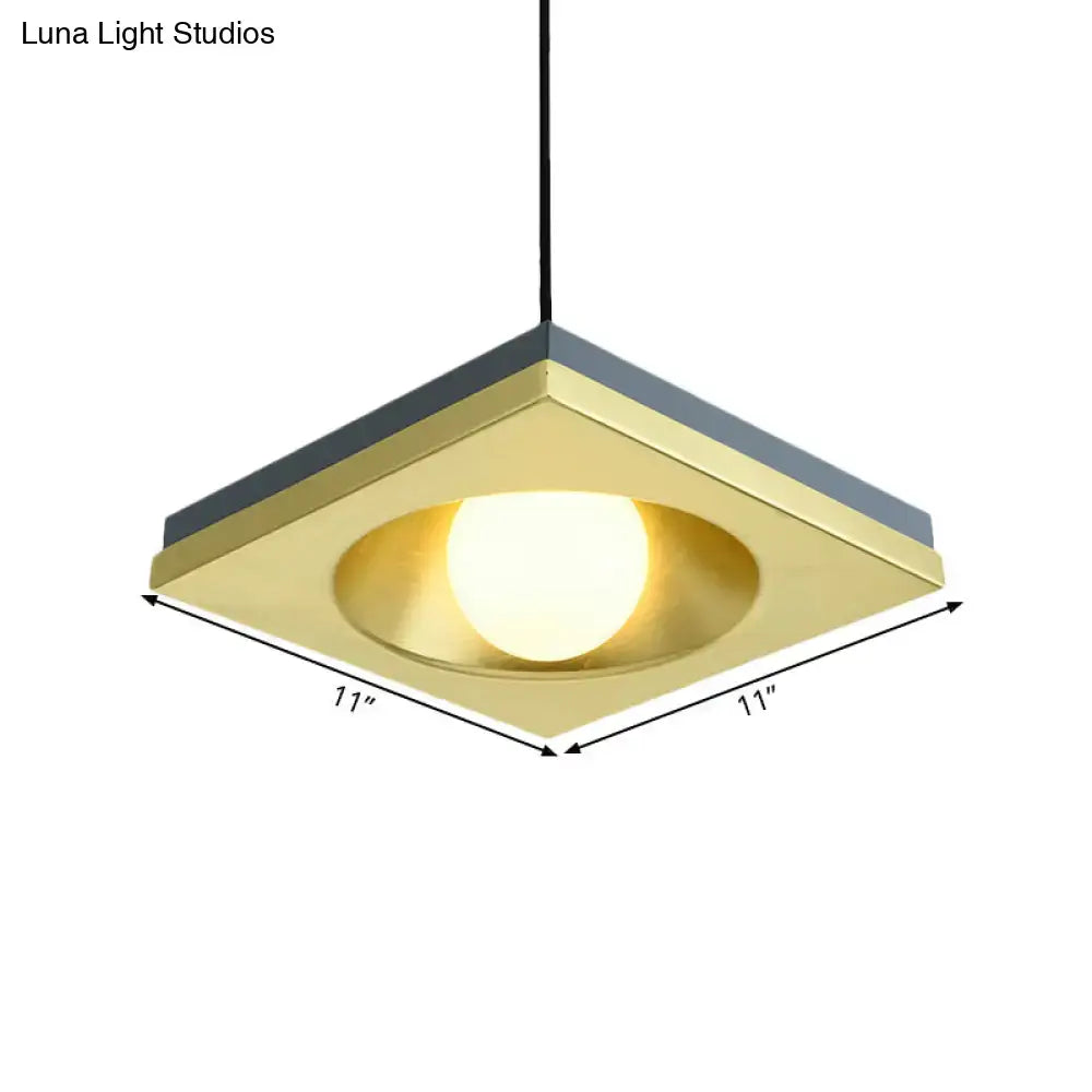 Decorbites modernist pendant light with brushed brass square frame dark gray trim and warm-toned bulb base for bedrooms