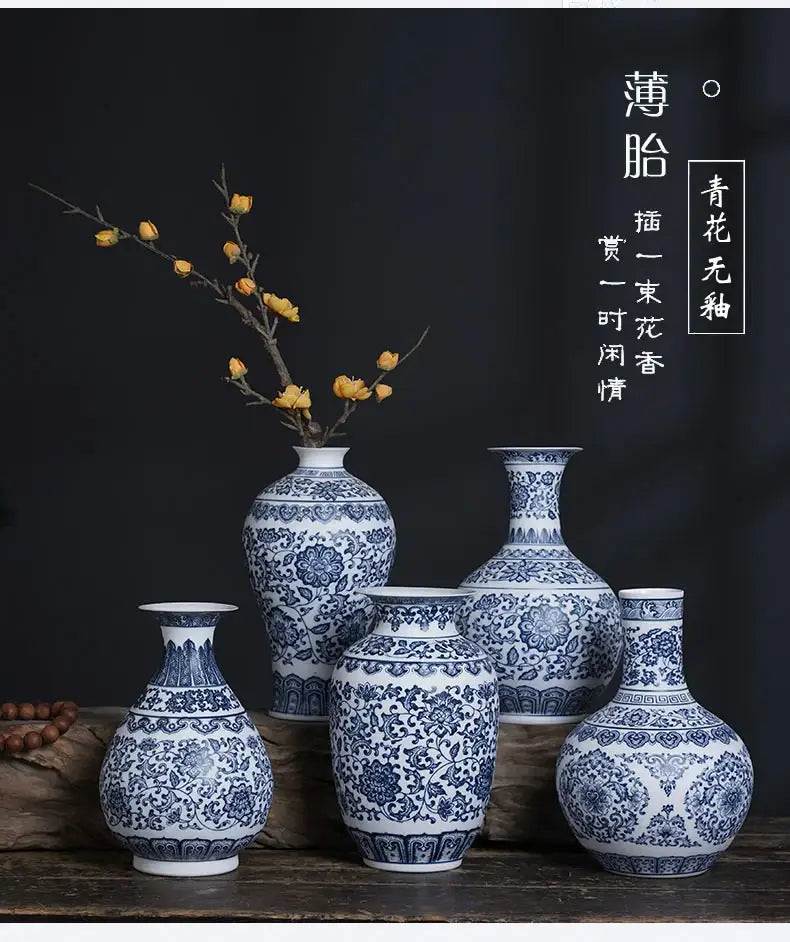 Set of five blue and white ceramic vases with intricate floral patterns for elegant home decor by DecorBites