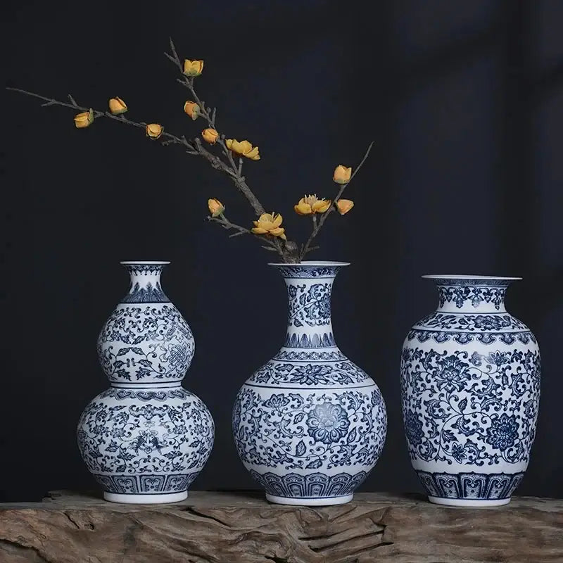 Three elegant blue and white ceramic vases with intricate floral patterns for stylish home decor by DecorBites