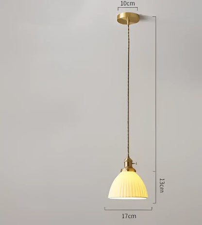 Vintage-style pendant light with brass-finished frame and cream ribbed glass shade for decorbites blue glass pendant light