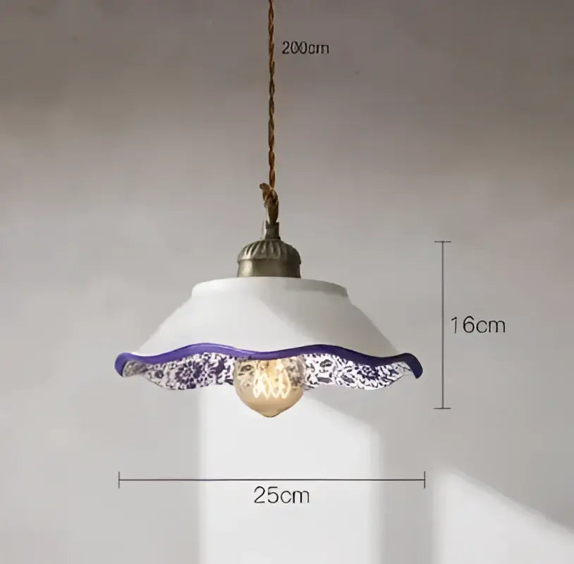 White ceramic pendant light with purple lace trim and exposed bulb complementing decorbites blue glass pendant light