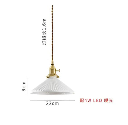 White ribbed glass pendant light with brass metal fixture and chain complementing decorbites blue glass pendant design