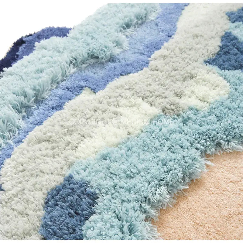 A decorbites boho chic shaggy rug with wavy blue and cream stripes perfect as a chic mossy rug bath mat or bedroom decor