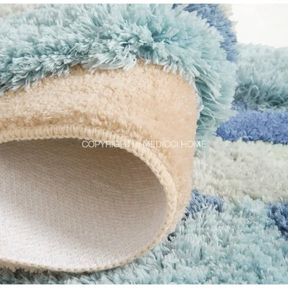 A plush decorbites boho chic mossy rug in soft blue and beige with shaggy texture for bedroom or bath use