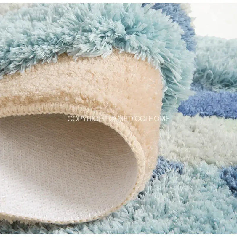 A plush decorbites boho chic mossy rug in soft blue and beige with shaggy texture for bedroom or bath use