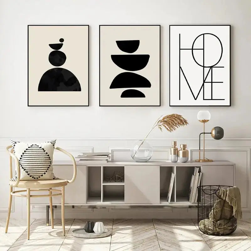 Three minimalist black and white framed boho geometric line canvas wall art prints above a modern console table
