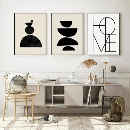 Three minimalist black and white framed boho geometric line canvas wall art prints above a modern console table