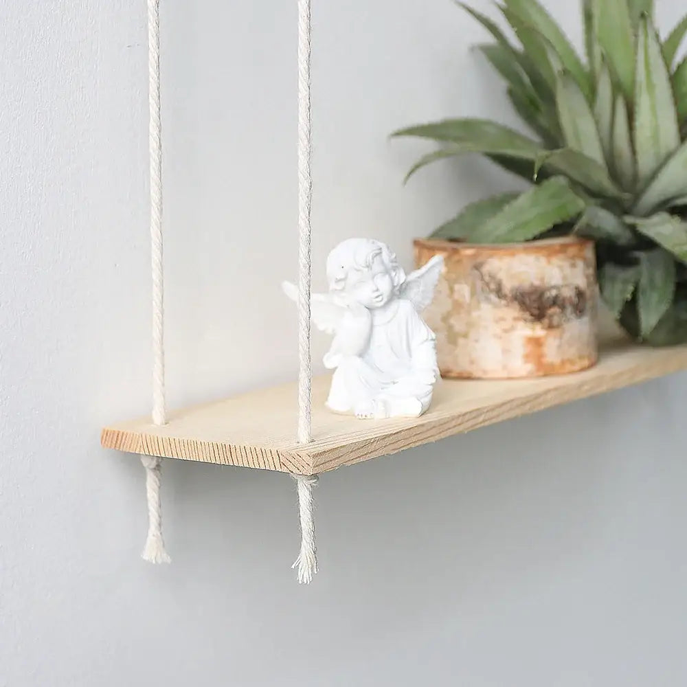 Decorbites™ boho macrame wall shelf with minimalist wooden design, white rope, angel figurine, and birch bark pot for home decor