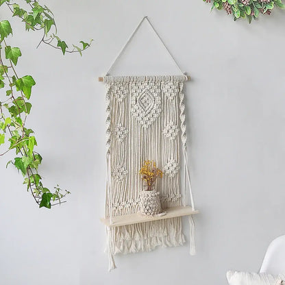 Cream-colored DecorBites™ boho macrame wood hanging shelf with decorative knots for stylish wall shelf home decor