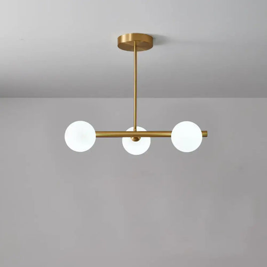Modern brass DecorBites pendant ceiling light with three frosted glass globe bulbs for dining room lighting kit