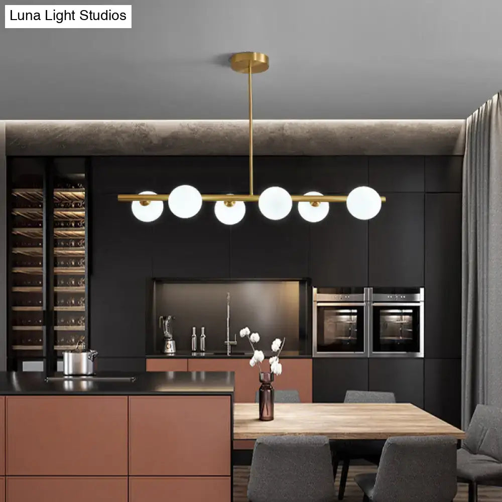 DecorBites brass island pendant ceiling light with five frosted glass globes for modern dining room lighting