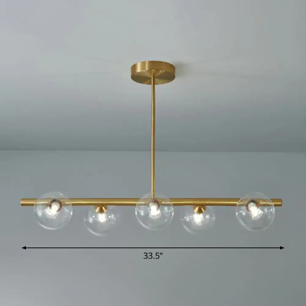 DecorBites brass plated glass sphere island pendant light with four clear white glass globe shades for dining room