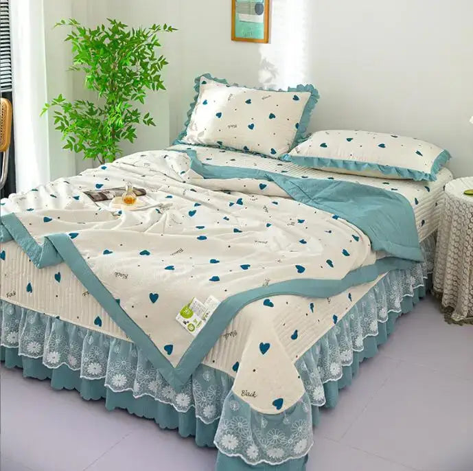 Cream-colored quilted cotton summer bedding cover set with teal heart patterns and lace trim by DecorBites