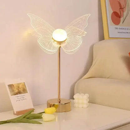 Decorbites butterfly gold acrylic led desk lamp featuring gold-toned butterfly wings and glowing spherical bulb for living room