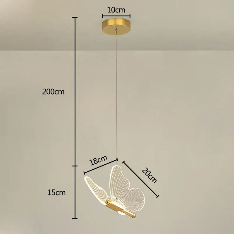Gold-toned decorbites butterfly pendant light with translucent wireframe wings and sleek metallic body for dining room