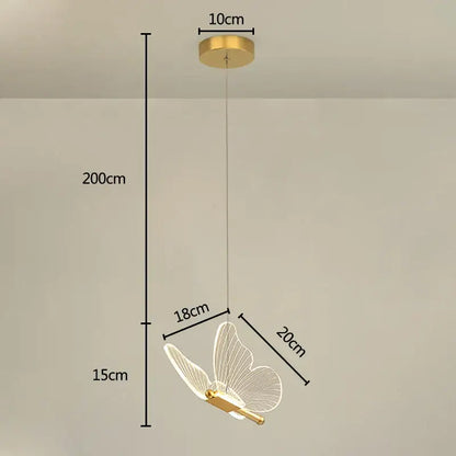 Gold-toned decorbites butterfly pendant light with translucent wireframe wings and sleek metallic body for dining room