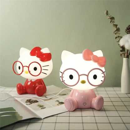 Two decorbites cartoon animal led night lights in red and pink featuring hello kitty with bows and glasses for bedroom use