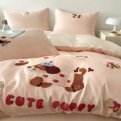 Pink satin duvet cover with plush brown and cream embroidered puppy wearing blue hat from decorbites cartoon embroidered cotton bedding set