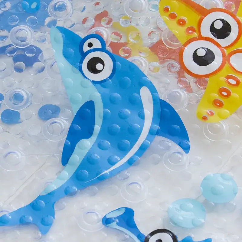 Blue dolphin-shaped decorbites cartoon non-slip bathroom mat with textured bumpy surface and large cartoon eyes