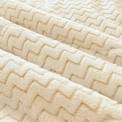 Cream-colored plush velvet fabric with a raised zigzag pattern in decorbites cartoon print quilted blanket