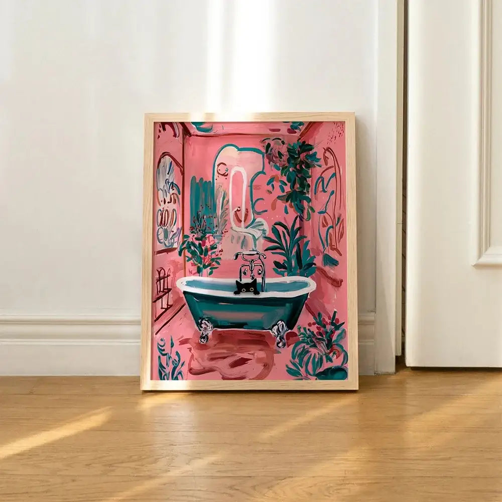 DecorBites™ cat reading toilet canvas wall art features vibrant pink frame with teal bathtub and black cat surrounded by plants