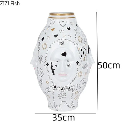 DecorBites™ ceramic vase desktop with white ceramic featuring black and gold whimsical face design for floral arrangements