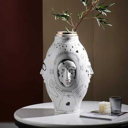 Decorbites™ ceramic vase desktop in white with black line art faces and gold rim for floral arrangements