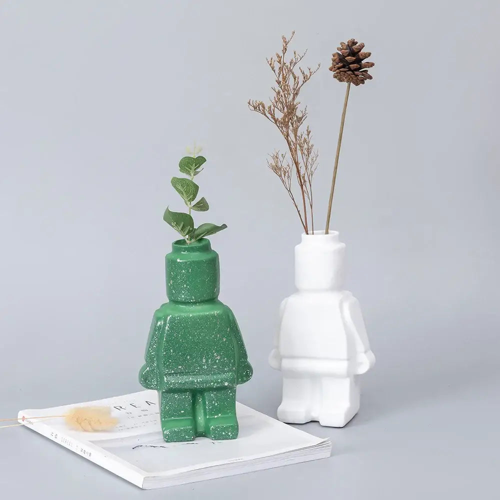 Decorbites™ ceramic robot vase in green glitter with nordic style featuring a small plant inside