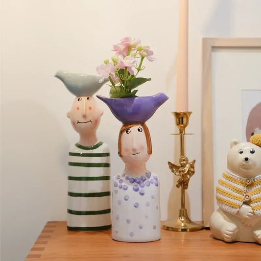 Decorbites™ ceramic vase set featuring two stylized ceramic vases in light blue and purple for home decor
