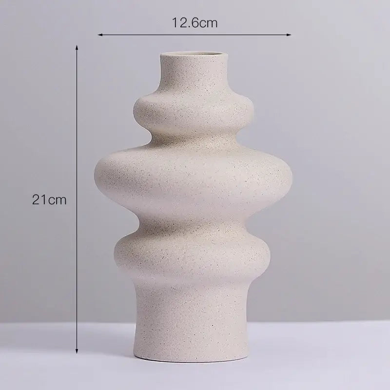Beige speckled ceramic vases with modern tiered design by DecorBites for stylish home decor and caprion ceramic vases