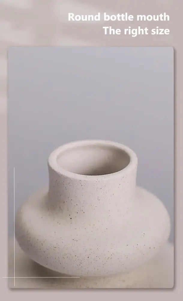 Cream-colored speckled ceramic vase with rounded bottle mouth from DecorBites™ ceramic vases for modern home decor