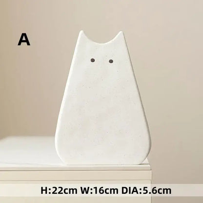 DecorBites™ charming cat-inspired white ceramic vase with minimalist design and black dot eyes for living room decor