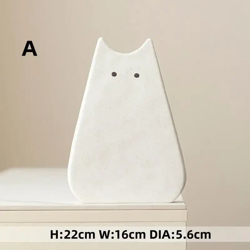 DecorBites™ charming cat-inspired white ceramic vase with minimalist design and black dot eyes for living room decor