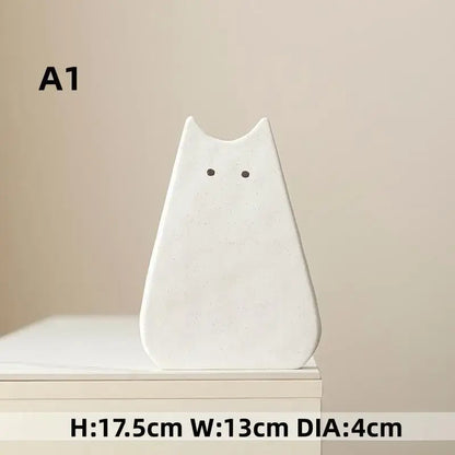 DecorBites™ charming white ceramic cat-shaped vase with minimalist black dot eyes perfect for living room decor