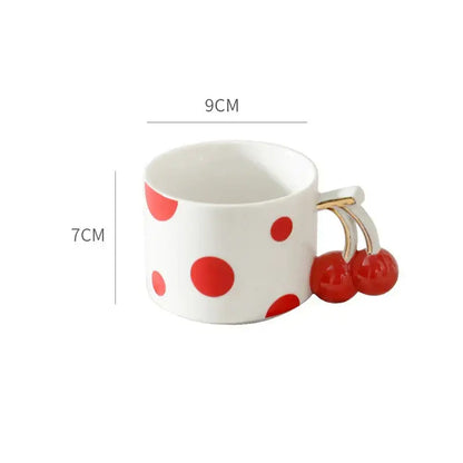 White ceramic coffee mug with red polka dots and decorbites cherry handle gold plated porcelain design