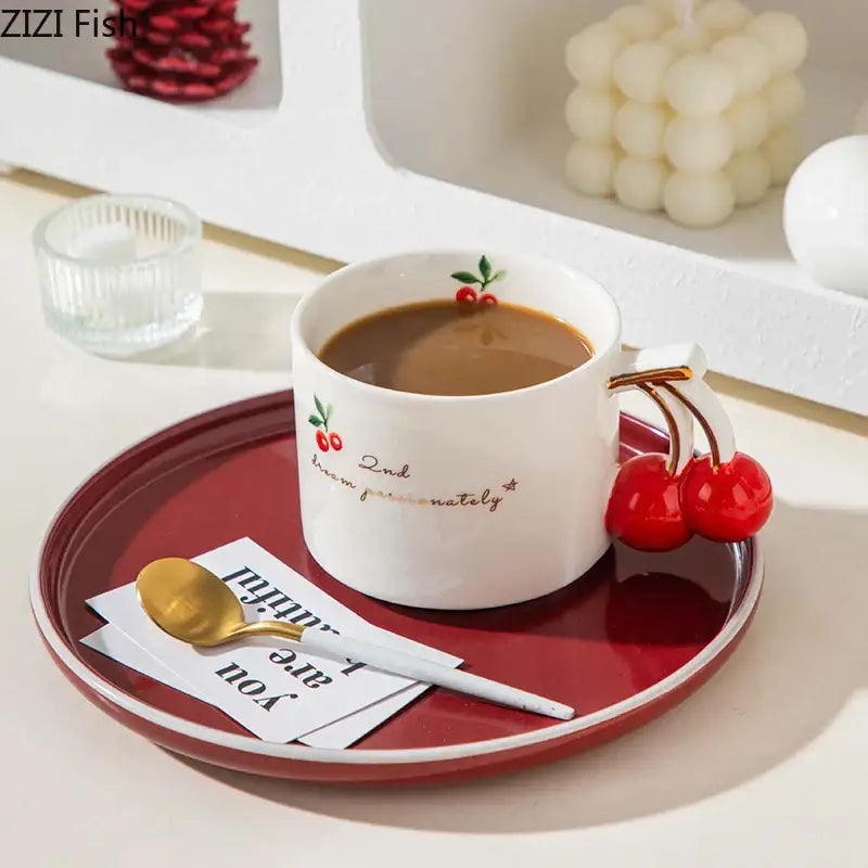 White ceramic porcelain coffee mug with red cherry handle and gilded edge featuring cherry pattern porcelain and 2nd time around text