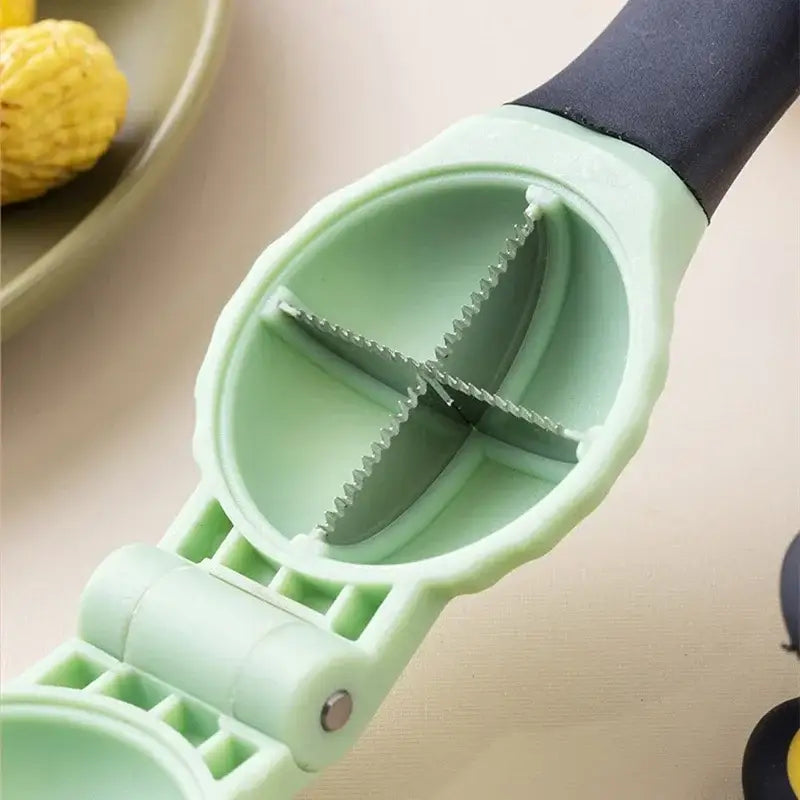 Light green plastic nut cracker with black handle and serrated metal blades in DecorBites chestnut machine set